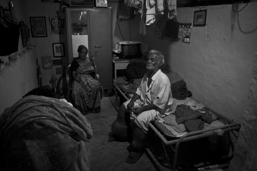 "Velayuthan pillai (Age 69), a tailor. Elephantiasis turned his life into misery by taking away both his legs. Having lost his legs and job, he returned back to his home town and joined as a guard for a temple for the pay of (Rupess 800) 17.60$ per month. With the help of this little income he's struggling to make both ends in life along with his wife." Photo by Rajvinoth Jothineelakandan.